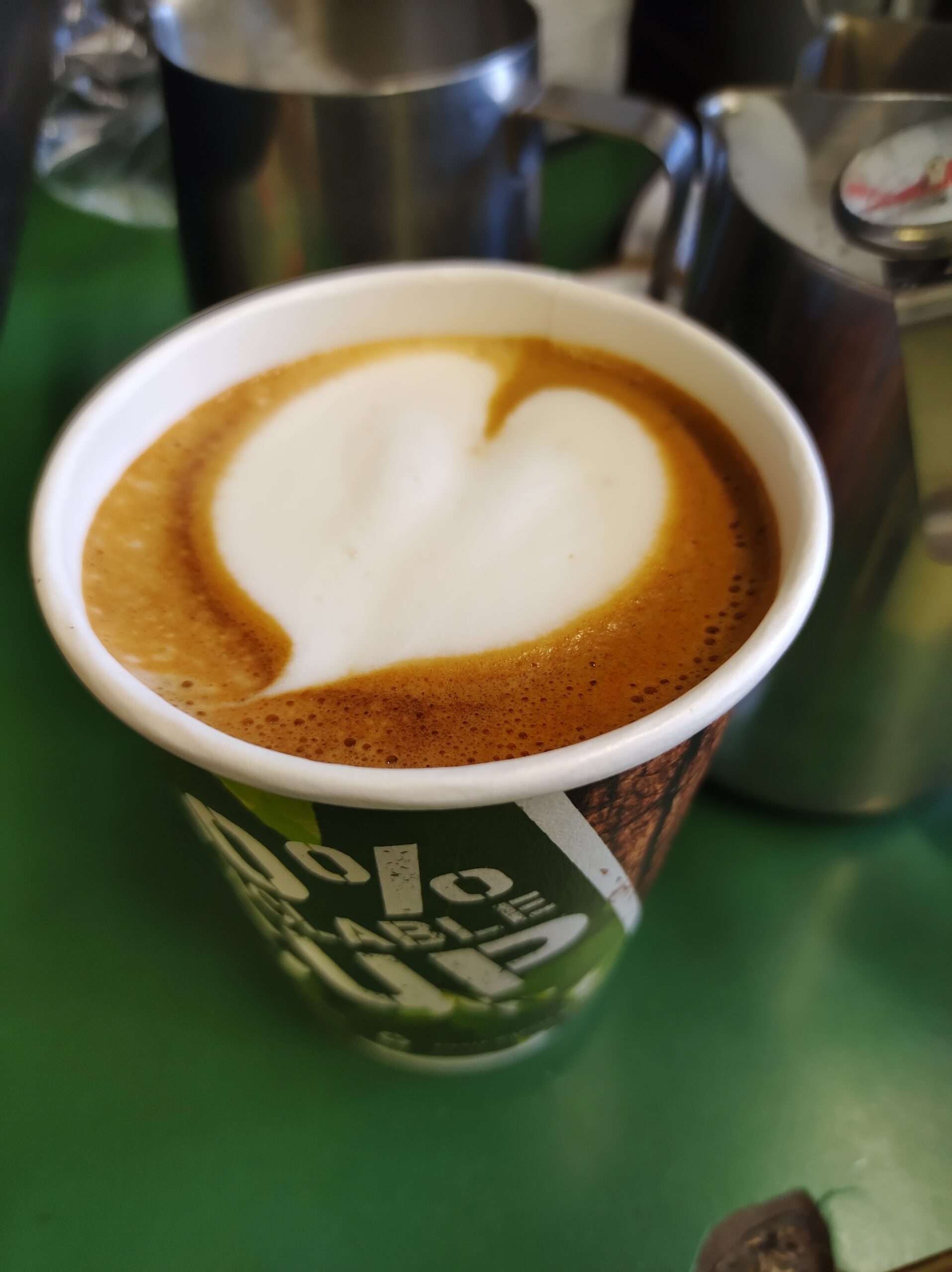 Takeaway coffee with heart-shaped latte art served at Diane’s Pantry café in Reepham.