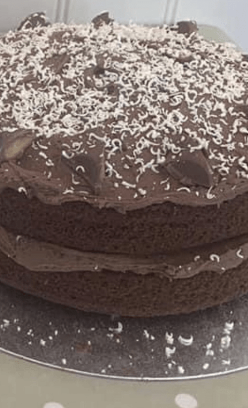 Rich chocolate sponge cake topped with chocolate icing and coconut at A Piece of Cake in Coltishall.