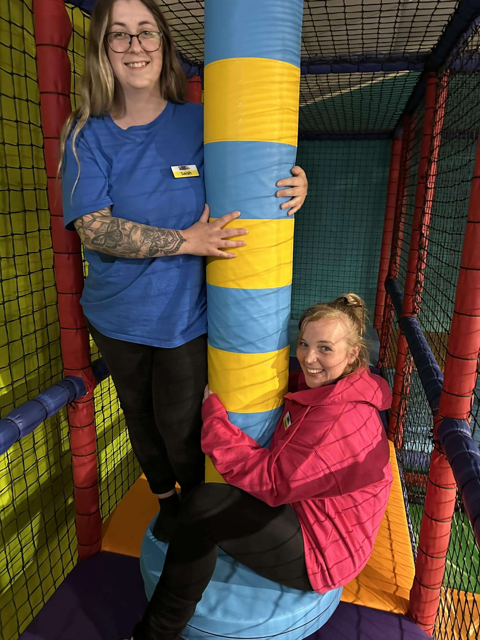 Colourful padded play equipment inside the soft play area at The Jolly Junction.