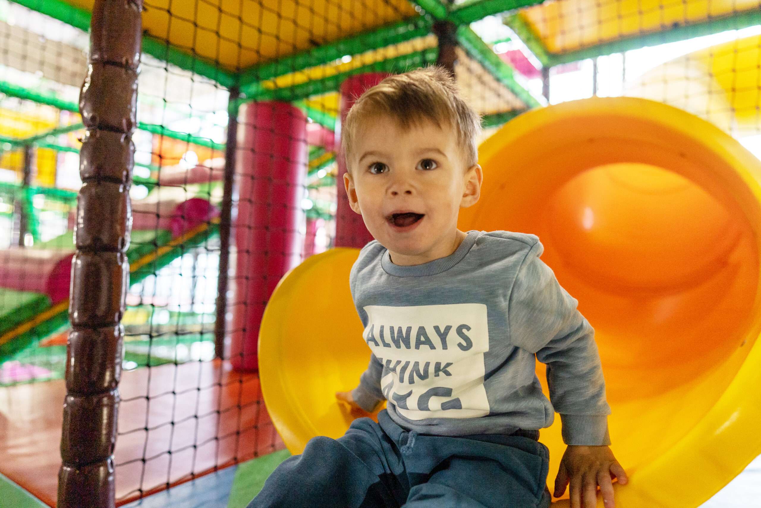 Visitors enjoying drinks and refreshments in the café seating area at Bananas Soft Play.