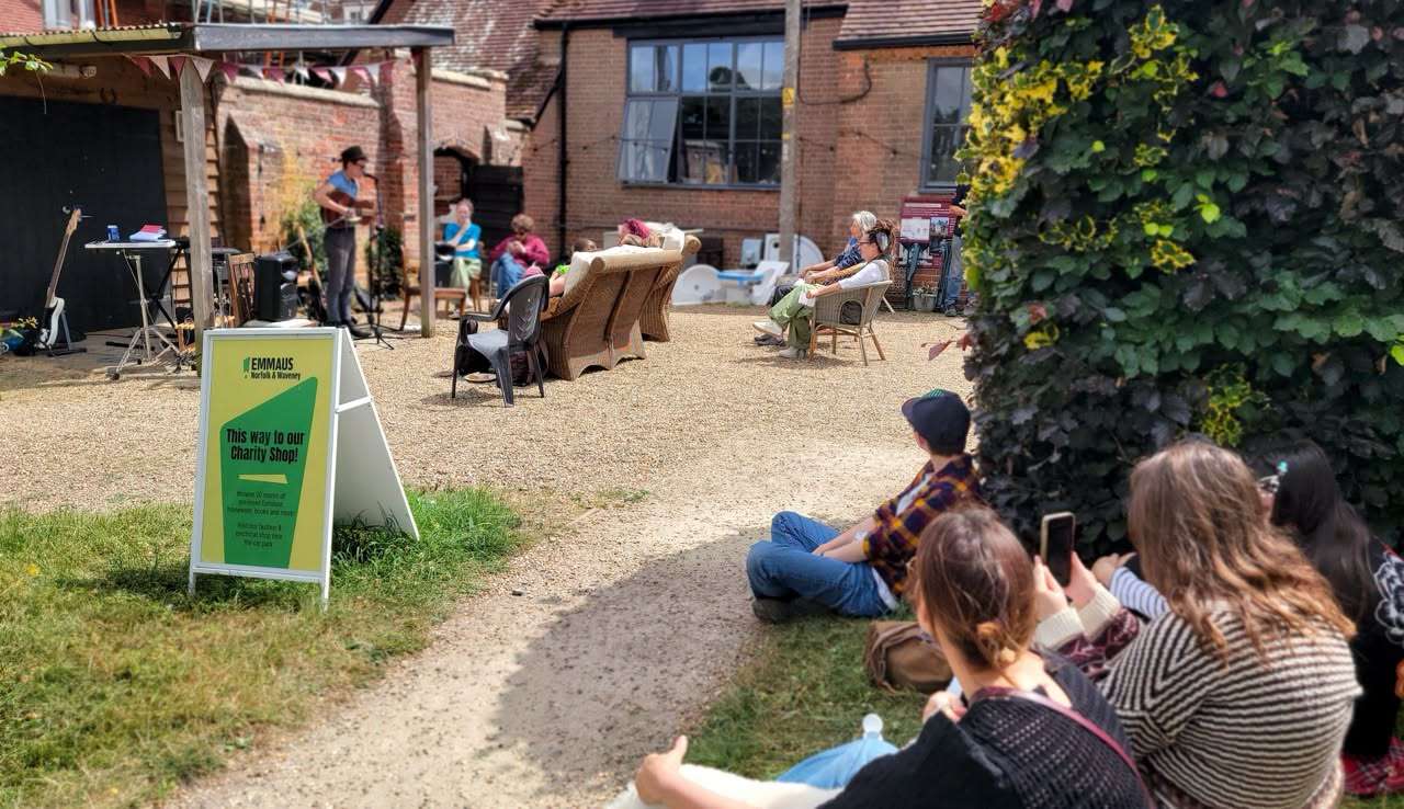 Visitors enjoying outdoor seating in the courtyard at Old Orchard Café, Ditchingham.